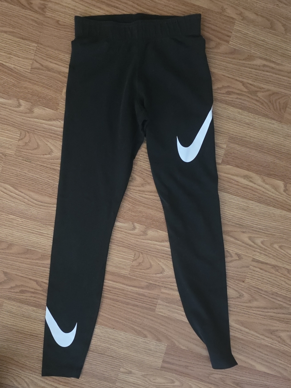 Nike Kids Black Leggings with White Swoosh Accents